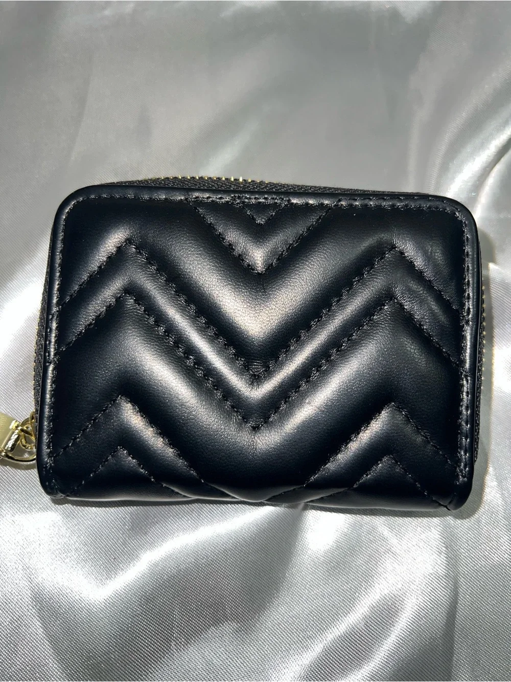 Black Quilted Leather Zip Wallet with Gold Emblem